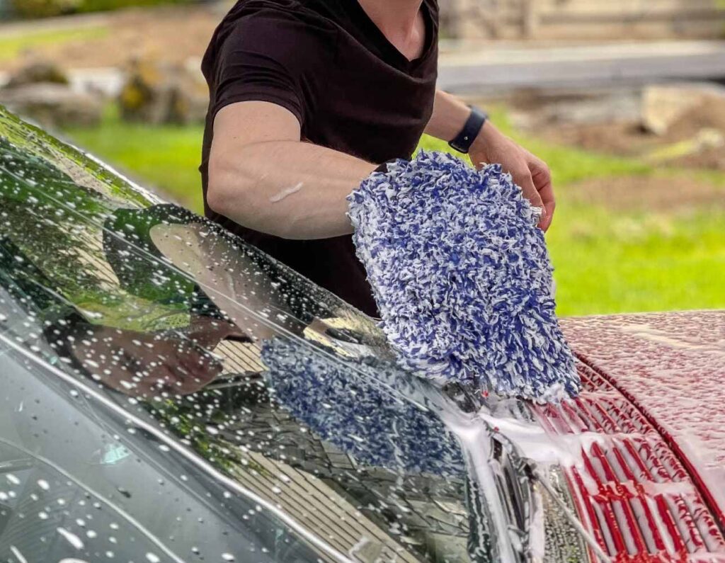 Auto Detailer cleaning a 1961 Chyrsler 300G with The Rag Company Cyclone microfiber wash mitt